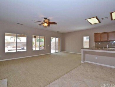 Great room with ceiling fan, and sliding glass doo