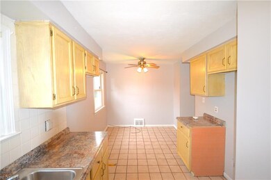 A view of the kitchen looking to the eat-in-kitche