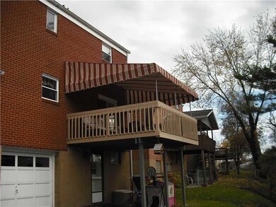 Exterior Front. Rear cover deck with canvas awning