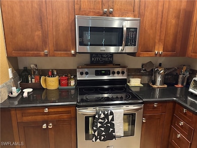Kitchen featuring stainless steel appliances, brow