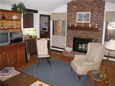 Family Room. Cozy family room with brick hearth fi