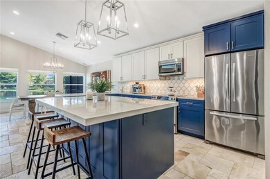 Kitchen featuring lofted ceiling, appliances with 
