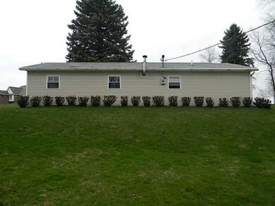 Exterior Front. side view of 4 car upper garage th