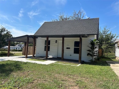 Porch and carport offering both charm and function.