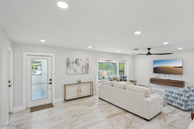 Living area featuring light marble finish flooring