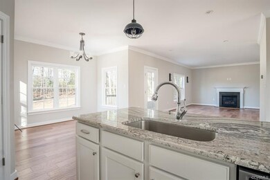 Kitchen island, eating area, family room photo of 