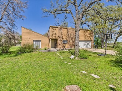 View of front of house featuring driveway, a front