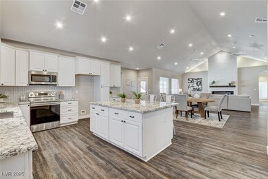 Kitchen with white cabinets, stainless steel appli