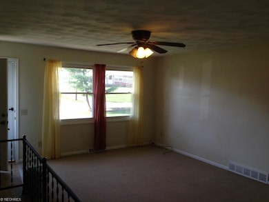 Large living room with newer vinyl windows