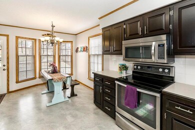Eat in Kitchen Area with door out to back patio an