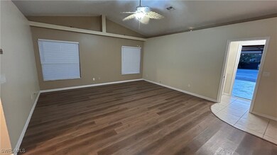 Spare room featuring ceiling fan, hardwood / wood-