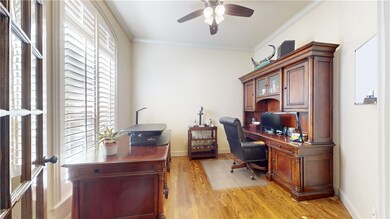 Office with French doors, floor-to-ceiling windows