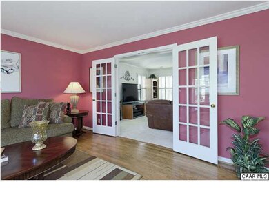 French doors lead from the living room into the fa
