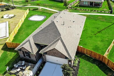 Wonderful Ariel view of your new home! Huge backyard and has Iron Gate that leads you right onto the walking paths!