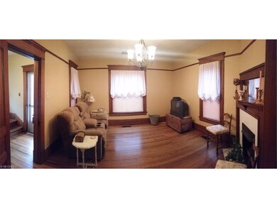 Living room with hardwood floors, insulated window