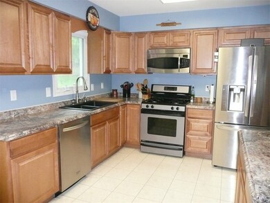 Updated, fully applianced kitchen with stainless steel appliances -- gas range, microwave oven, dishwasher and refrigerator.