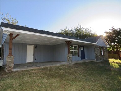 Carport with door to pantry, 3rd bedroom and hall to kitchen.