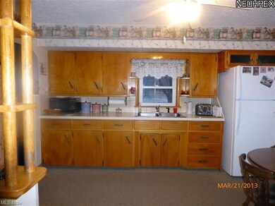 Country size kitchen with eating area.