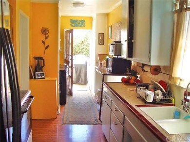 The kitchen has a laundry area and opens to the re
