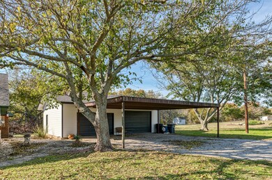 Two garages and a carport provide ample parking fo