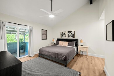 Bedroom with access to exterior, light wood-style