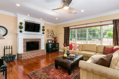 The custom designed fireplace mantle beautifully c