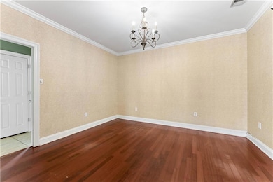 Dining room has lovely chandelier
