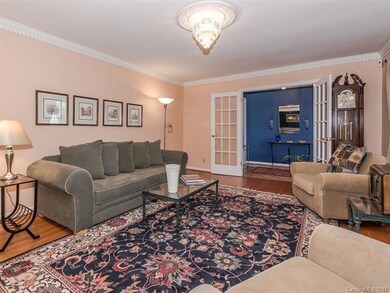 French Doors accent the oversized Formal Living Ro