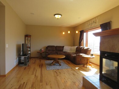 Gleaming hickory hardwood floors flow throughout t
