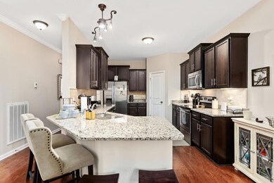 Crown molding; Custom light fixtures; beautiful hardwood floors