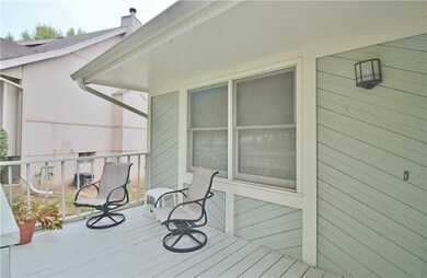 Partially covered front deck/porch and entrance to