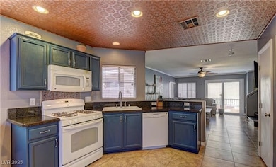 Kitchen with a sink, plenty of natural light, a pe