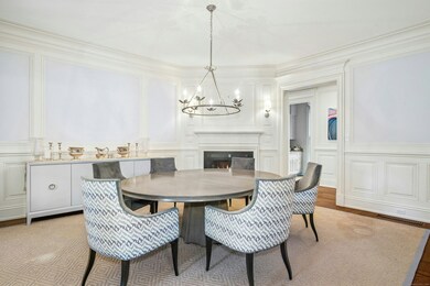 The warm and sophisticated dining room with firepl