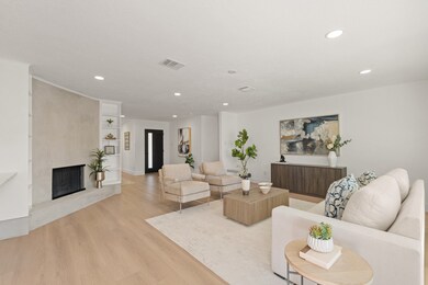 A view of the beautifully refinished fireplace and a feel of the home from back to front.
