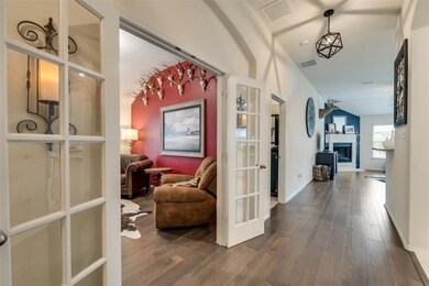 Corridor featuring french doors and dark hardwood / wood-style floors