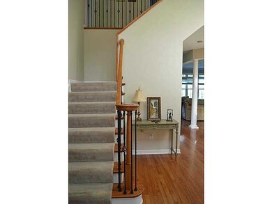 Entry/Foyer. Turned staircase with wrought iron sp
