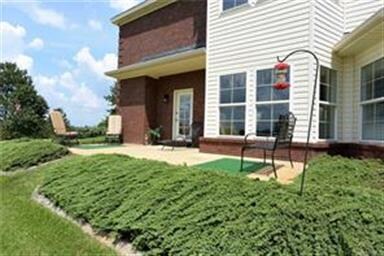 THIS LARGE CONCRETE PATIO IS PERFECTLY LOCATED ON 