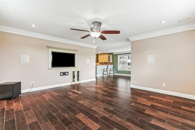 Living room is just off of the entry and open to t