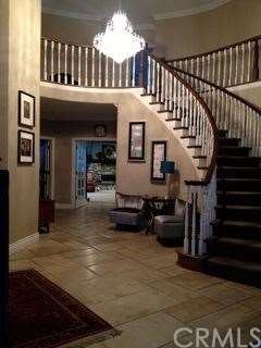 Gorgeous, sweeping staircase view from the entry w