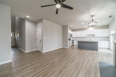 Another spacious view of the family room. The  closest door leads to the large 8' tall 2-car garage!  You can even park a truck in this garage!