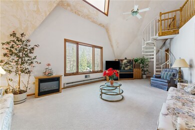 Living room features wall to wall carpeting, large