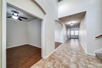 Corridor featuring arched walkways, ornamental mo