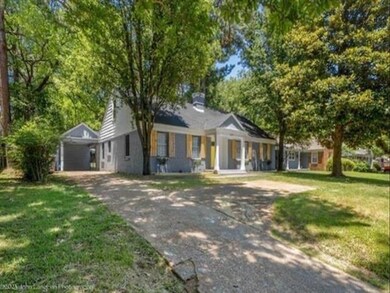 View of front of property with a front lawn