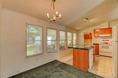 The kitchen opens up to the dining room. This grea