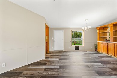 Open dining room with built-in china cabinet