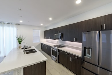 Kitchen with appliances with stainless steel finis