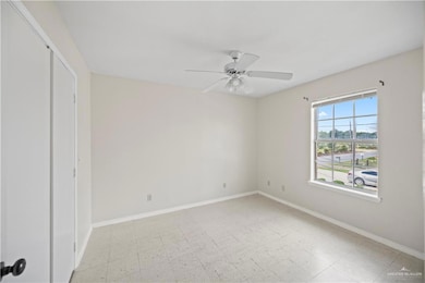 Unfurnished bedroom with ceiling fan and light floors
