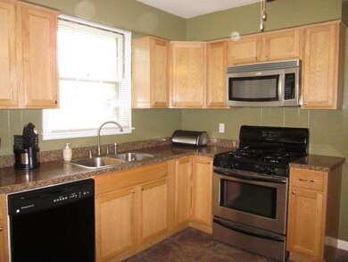 New stainless steel gas range and new flooring.