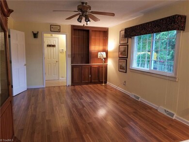 Family/Dining room, note the built-in shelving and walnut cabinets.