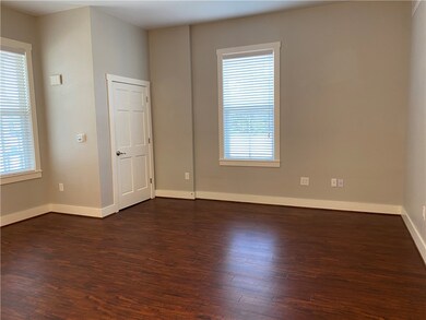 Bedroom featuring dark wood-style flooring, health